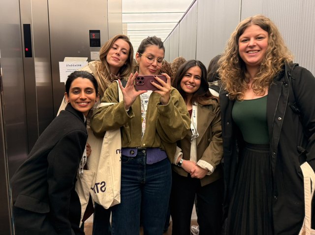 The team in a lift after the hackathon
